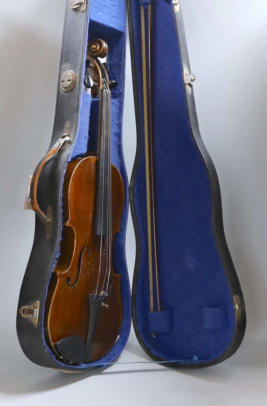 A Maidstone violin, with bow, cased. violin 59 cms high.